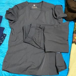 Adar Scrubs set in small size and grey colour .